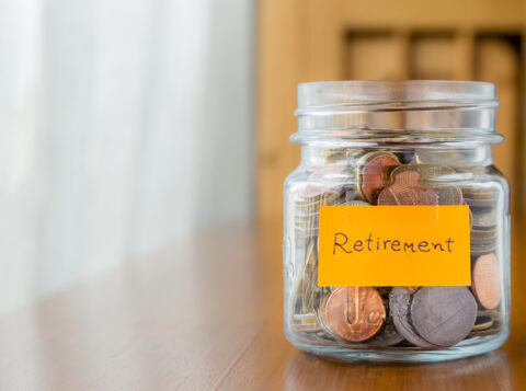 Jar with coins in it saving for retirement